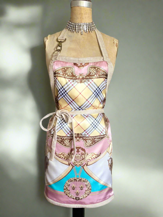 Decorative apron with a pattern on a mannequin against a neutral background