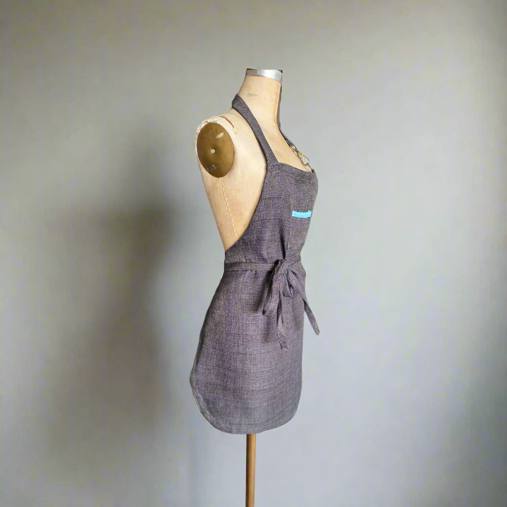 Petite lux apron with aqua colored rim detail, side angle view
