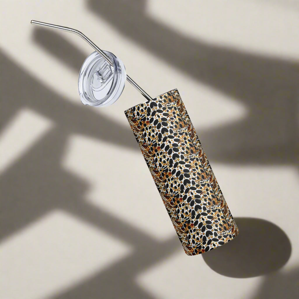 Glossy snake print tumbler floating on white background with clear lid visible