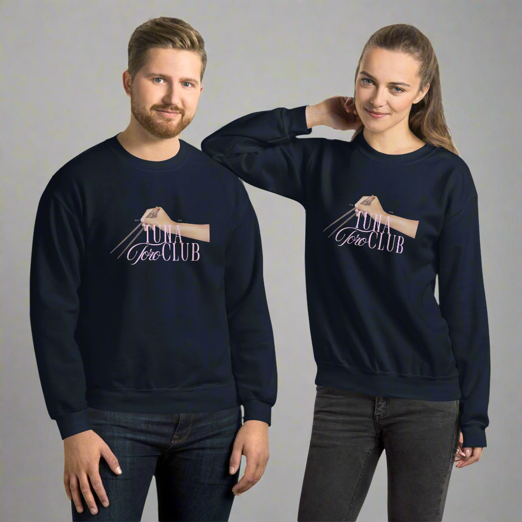 Tuna Toro Club sweater worn by a male and female showing the unisex versatility with chopsticks graphic and pink typography