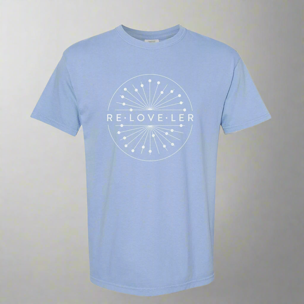 A light blue t-shirt with a white elegant glitter circle logo design
