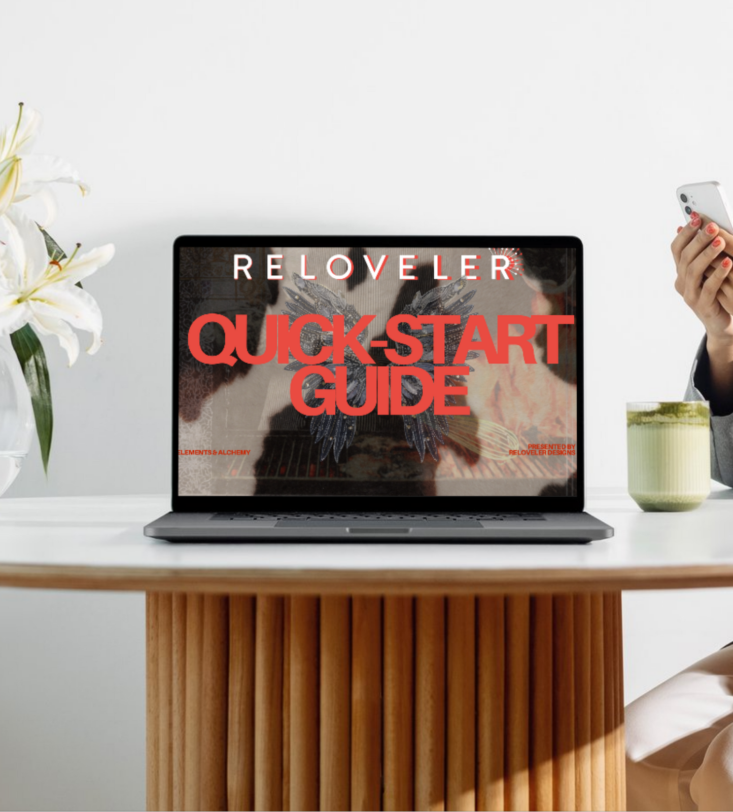 Woman using a smartphone at a table with elegant decor and a laptop displaying 'RELOVELER QUICK START GUIDE'.