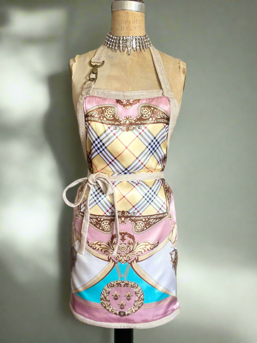 Decorative apron with a pattern on a mannequin against a neutral background
