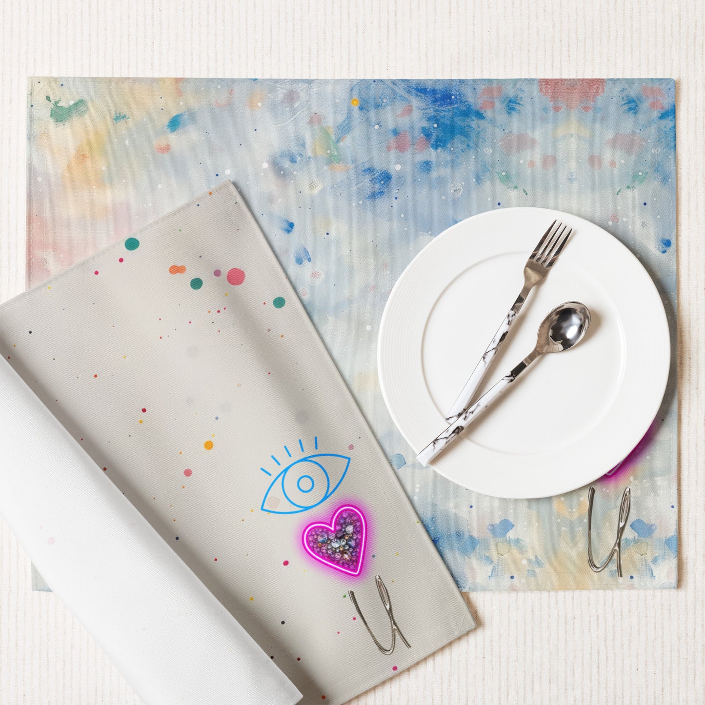Close-up of neon heart and eye graphic on placemat