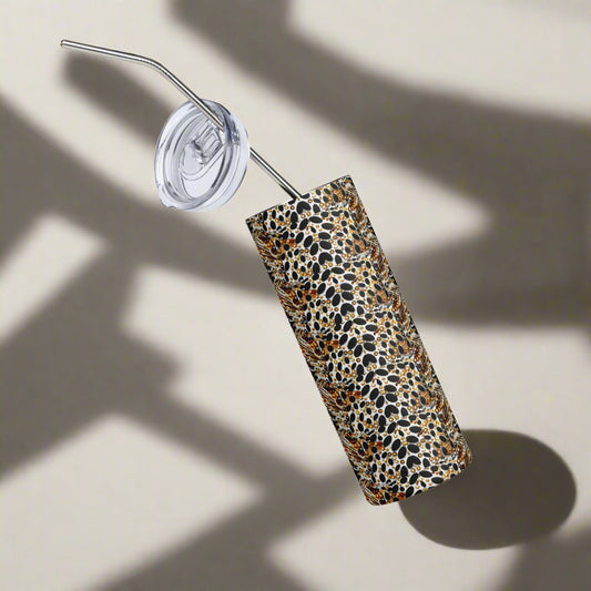 Glossy snake print tumbler floating on white background with clear lid visible