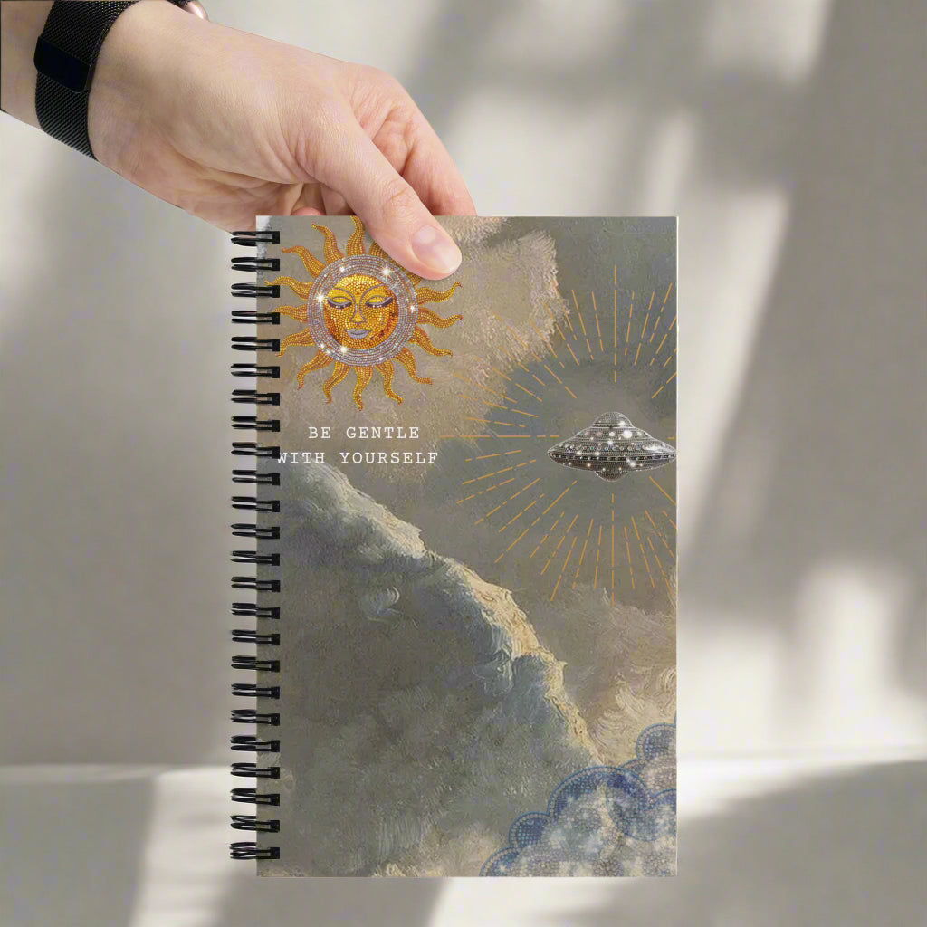 A hand holding the Be gentle with yourself, Radiant Sun Journal