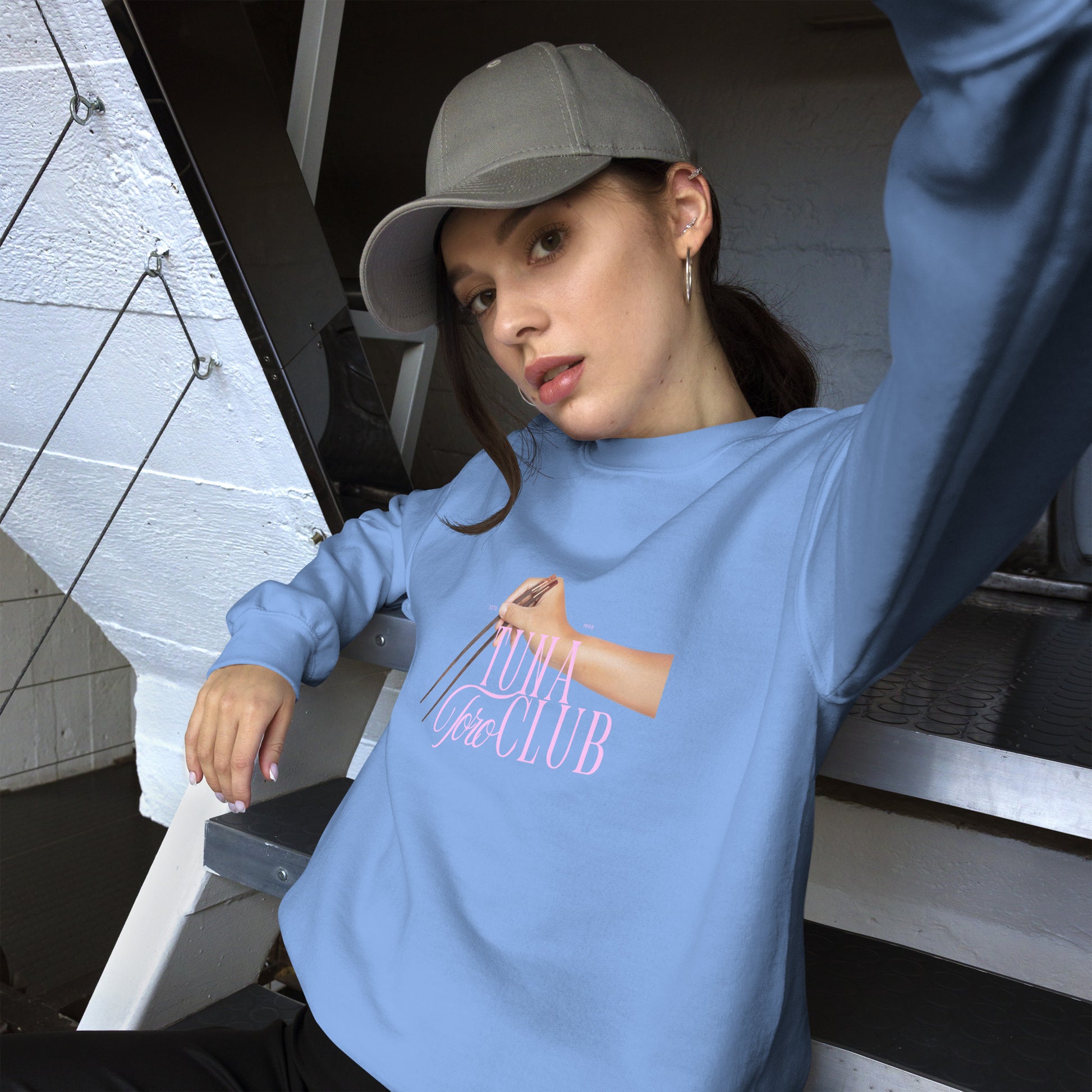 Woman taking selfie wearing the Japanese cuisine inspired sweater showing Tuna Toro Club design