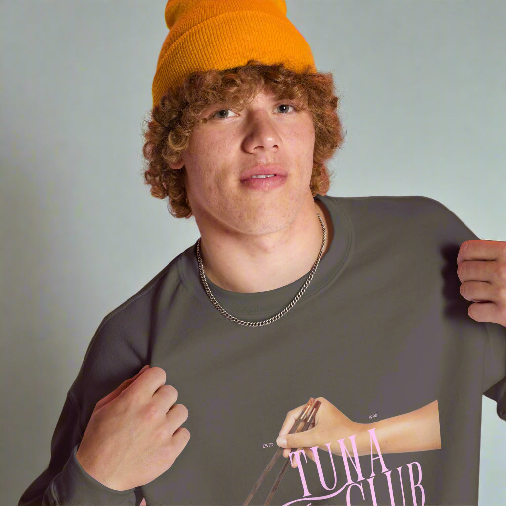 Close-up of Tuna Toro Club sweater design with chopsticks graphic