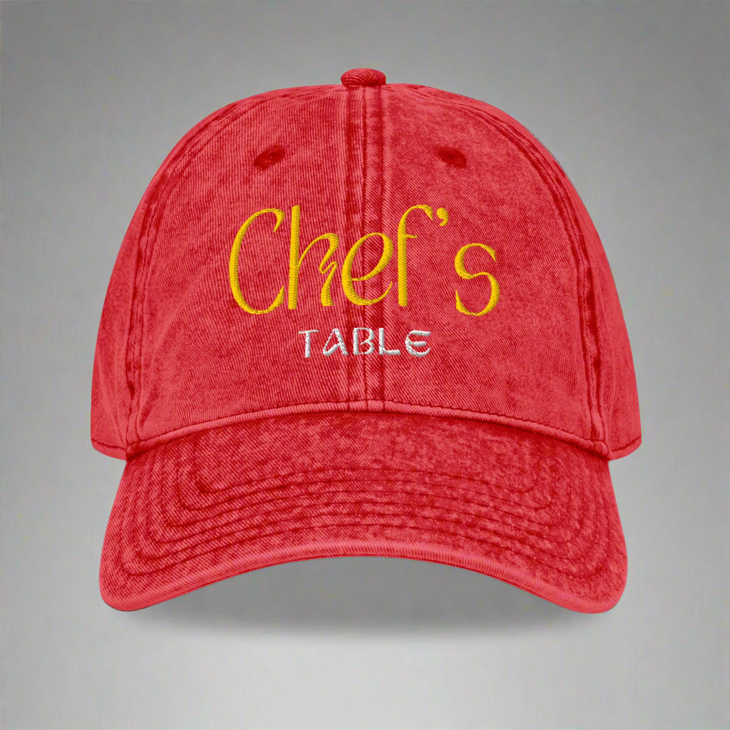 Close-up of red Chef's Table embroidered cap showing vintage washed finish