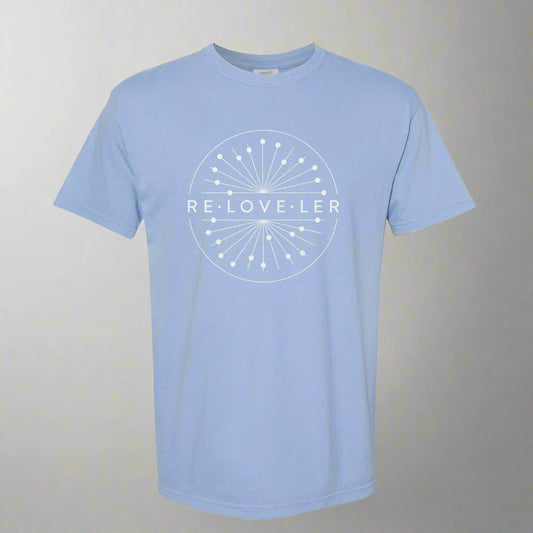 A light blue t-shirt with a white elegant glitter circle logo design