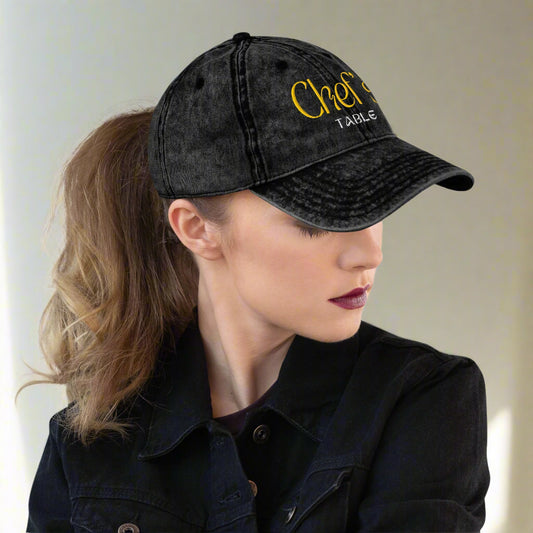 Low profile unstructured cap with culinary themed embroidery as seen on woman with pony tail 